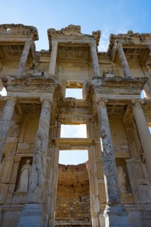 Detailed view of imposing ancient columns offering an interior view through an architectural