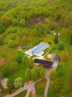 Waldfreibad Eningen unter Achalm, leisure centre with swimming pool surrounded by forest and