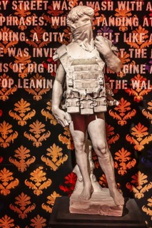Banksy - Adaptation of Michelangelo's David sculpture as a suicide bomber, 2009, exhibition The