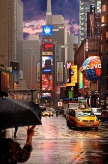 Evening Times Sqaure with illuminated advertising in the rain, New York City, USA