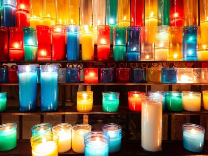 Colourful devotional candles in a church in Barcelona, Spain