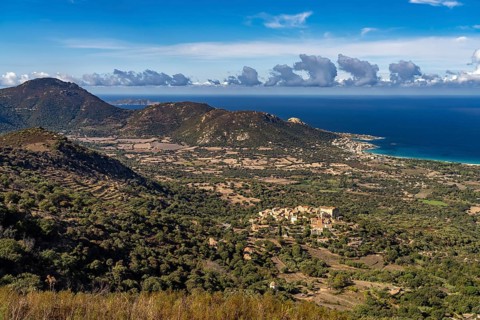 The Balagne countryside with the village of Pgna and the coast near Algajola seen from above,