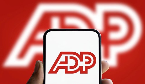 ADP logo is displayed on smartphone. Automatic Data Processing Inc is an American provider of human