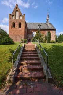 St Martin's Church, Evangelical Lutheran parish of Zetel, brick staircase, metal railings, lawn,