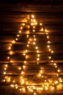 Glowing Christmas decoration on a wooden wall, Alvdal, Hedmark, Innlandet, Norway, November 2025