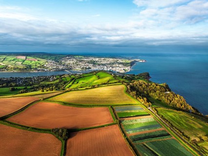 Fields and Farms at evening sun from a drone, Shaldon, Torquay, Devon, England, United Kingdom