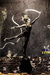 Banksy - Dancer on rubble, painting on a destroyed house wall in the Ukraine, exhibition The World