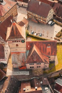 Historic church and surrounding half-timbered houses in an urban old town area, Ötisheim, Enzkreis,