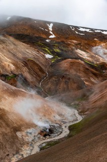 Steaming streams between colourful rhyolite mountains, Hveradalir geothermal area, Kerlingarfjöll,