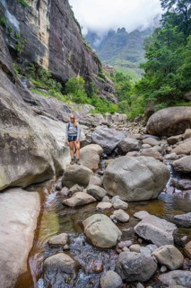 Female hiker in the Tugela Gorge or Tugela Gorge in the riverbed, Drakensberg National Park,