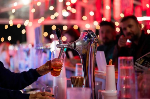 Pouring draft beer into a mug in a pub