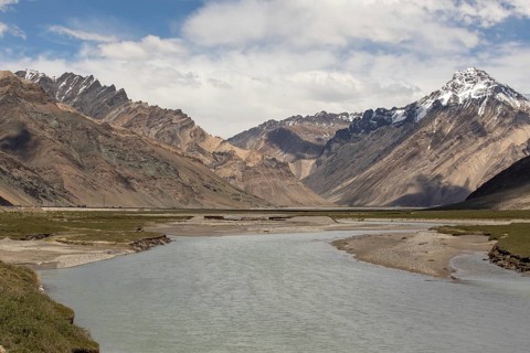 Stunning view of snow capped mountains and a winding river in Zanskar Valley, Ladakh, India,