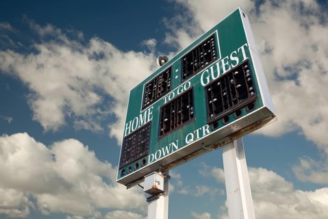 HIgh School Scoreboard with a Beautiful Sky and Clouds Background