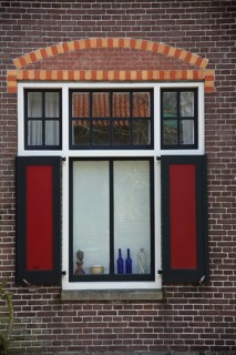 Window with red shutters and decoration on window sill, window sill, house facade, brick house, Den