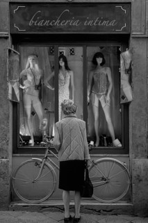 Elderly lady in front of an erotic shop window, montage, Siena, Tuscany, Italy