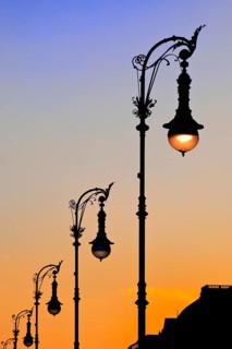 Old Berlin gas lanterns in the street Unter den Linden At sunset, Berlin, Germany