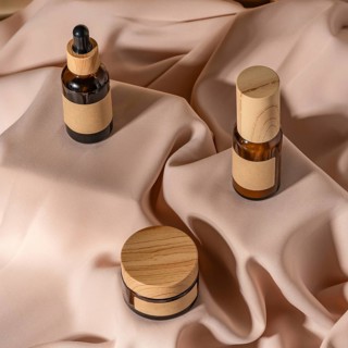 A collection of eco-friendly skincare products displayed on soft, beige fabric The set includes