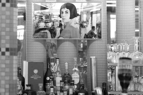 Poster above the bar at Café des Deux Moulins, filming location of the movie The Fabulous World of