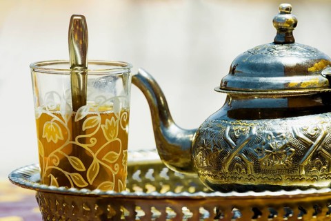 Silver teapot and tea glass with peppermint tea, Morocco