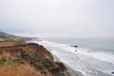 Rugged coastal landscape with cliffs and waves under cloudy sky, Humboldt Redwoods State Park,