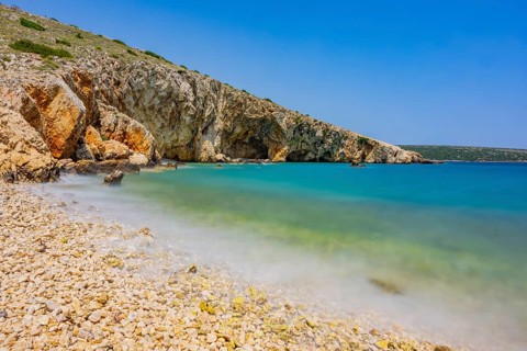 Romantic view over the sea in Koromacna Bay on a sunny day with rough seas on the island of Cres,