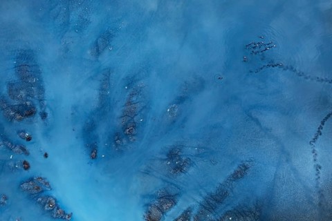 A detailed aerial capture of a lagoon in Toledo, Spain, highlighting unique natural formations and