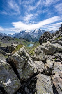 View of mountain lake Lac du Louvie and glaciated mountain peaks of the Grand Combine, Valais Alps,