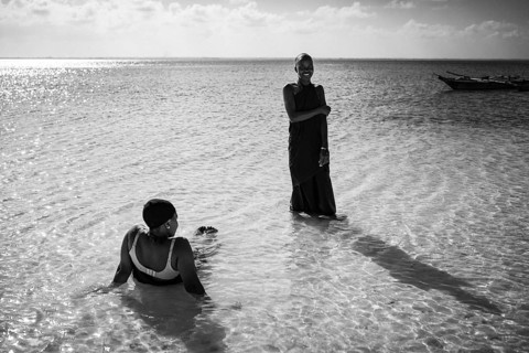 MICHAMVI, ZANZIBAR - OCTOBER 15, 2025: Black and white lifestyle photograph of two African women