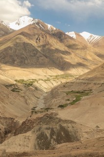 Stunning panoramic view of the arid mountain landscape in Nubra Valley, India, showcasing rugged