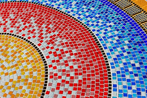 Floor covering decorated with small, colorful stone tiles, Buddhist temple complex Wat Phra That
