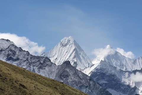 The image captures the breathtaking view of Mount Everest, with its snow-capped peak reaching