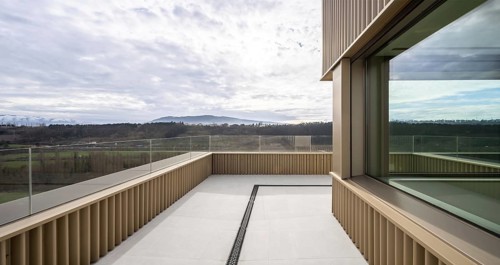 Contemporary open balcony showcasing panoramic natural vistas, modern architectural elements, and