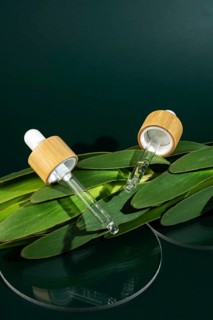 Transparent micellar water for facial care, presented in a stylish pipette bottle, rests atop