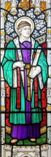Saint Ivo of Kermartin as a lawyer, stained glass window, Ansford church, Somerset, England, UK c
