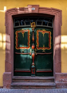 Decorative entrance door on a block of flats, Miltenberg, Bavaria, Germany