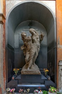Sculptures on a grave in a niche in the Monumental Cemetery, Cimitero monumentale di Staglieno),