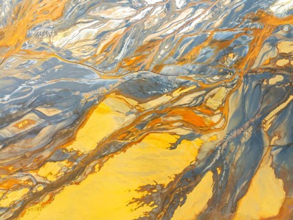 Top view of striking abstract nature textures captured by a drone, showcasing vivid colors and