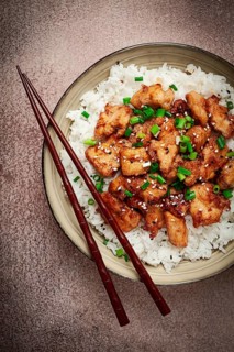 Fried chicken teriyaki with rice, green onion and sesame, homemade, no people