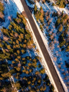 Bird's eye view of a snow-covered road in a straight line, Seewald, Black Forest, Germany
