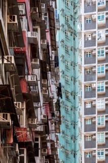 An intricate view of densely packed high-rise residential buildings in Hong Kong, highlighting