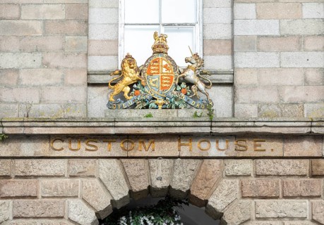 Lion and Unicorn Royal Arms heraldic shield, Custom House building, The Barbican area, Plymouth,