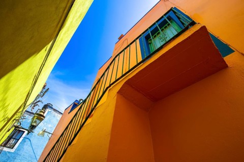 From below colorful buildings of Guanajuato, Mexico, illustrating the vivid colonial architecture