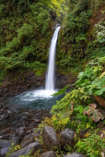 La Paz waterfall, waterfall in dense green vegetation, long exposure, Alajuela province, Costa Rica