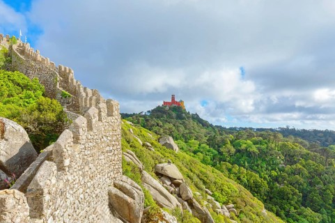 View of Castelo dos Mouros and Pena Palace in the distance, Sintra, Portugal