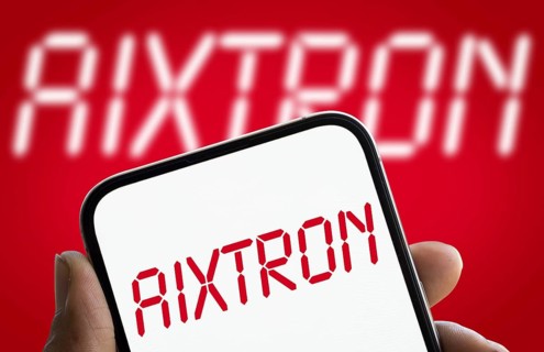 AIXTRON logo is displayed on smartphone. Aixtron SE is a European multinational technology company.