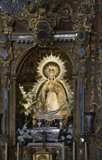 Religious female statue inside an elegantly decorated church in Ronda, Spain