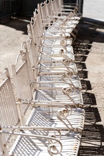 Row of white steel chairs in Barcelona, Spain