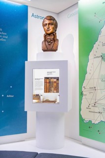 Bust on a pedestal in front of a wall, part of an exhibition on astronomy and geodesy, Bohneberger