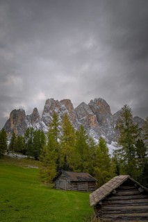 View of a part of the Geisler group in the foreground two mountain huts, Dolomites, snow,