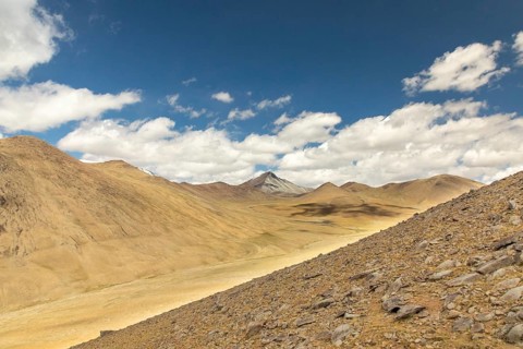 A breathtaking view of the barren, rugged mountains in Ladakh, India, showcasing the stark beauty
